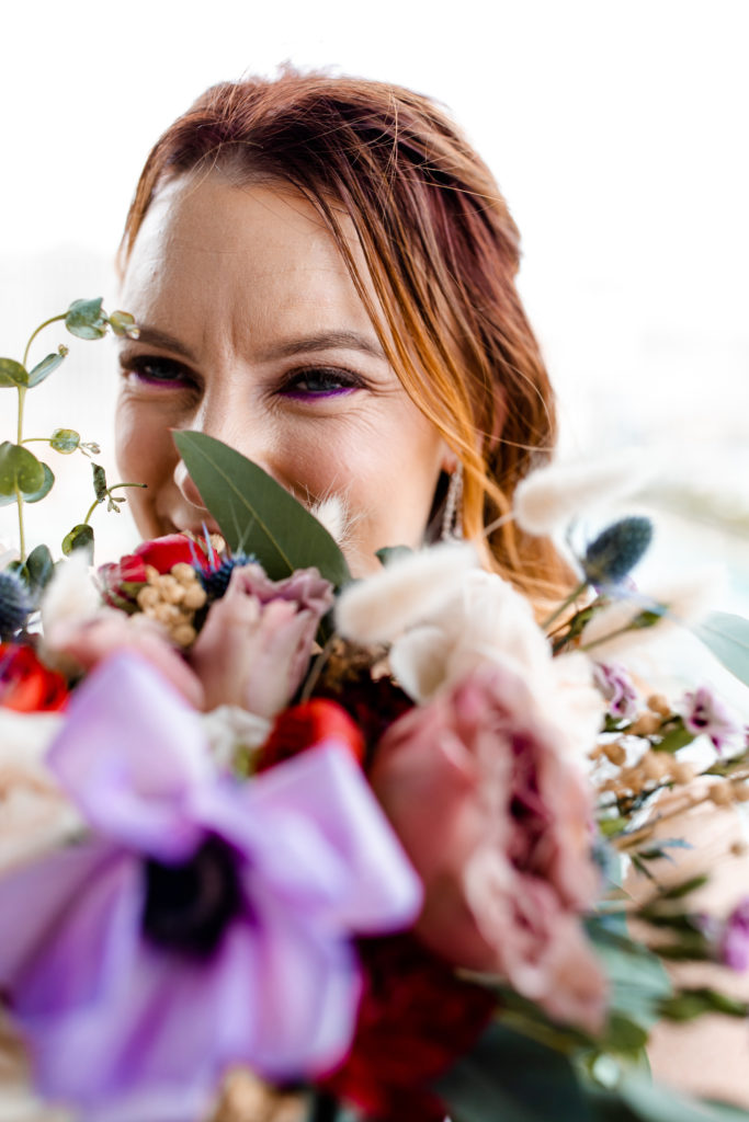 purple makeup and flowers for elopement