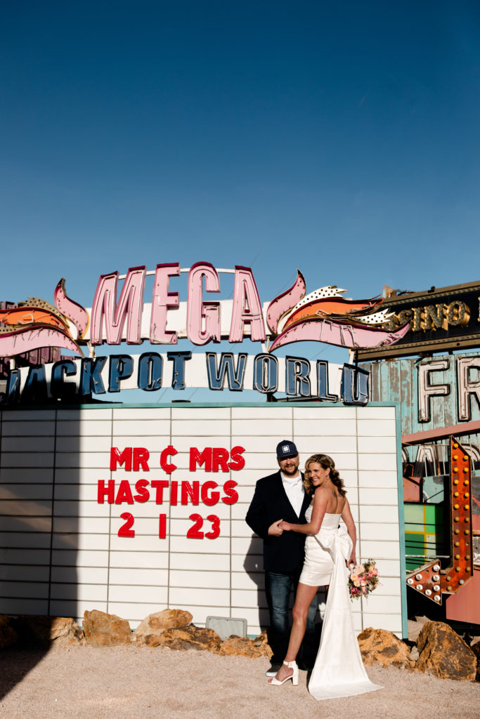  A Neon Museum Elopement with a custom marquee sign for the bride and groom