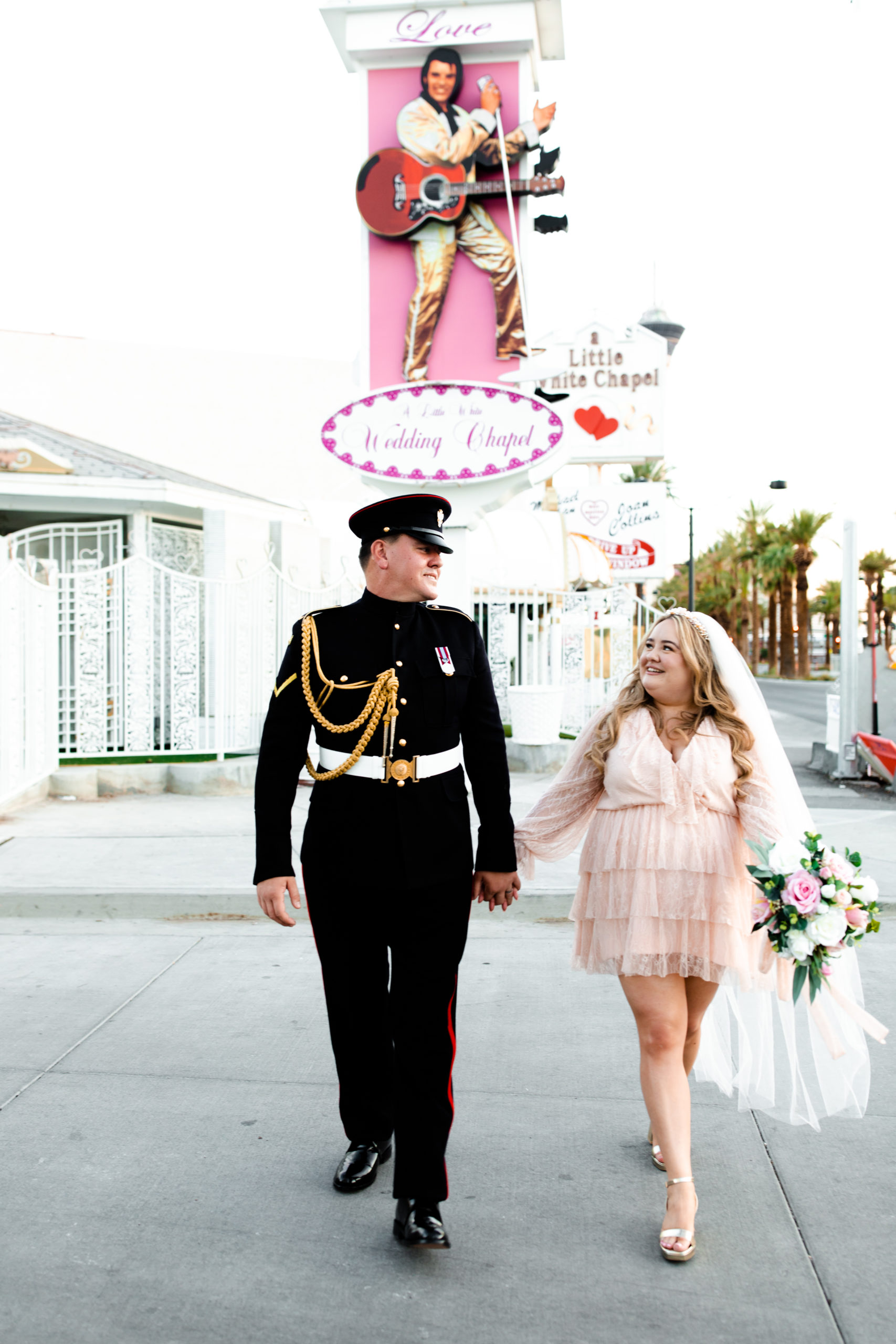A bride and groom celebrating their elopement at the Little White Chapel in Las Vegas