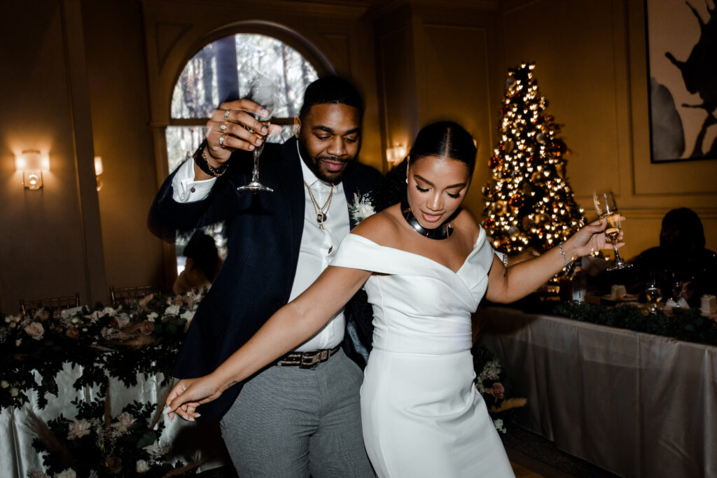Bride dancing during her Christmas wedding reception