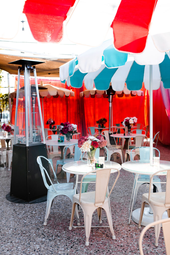 The colorful, umbrella covered outdoor patio at the Velveteen Rabbit