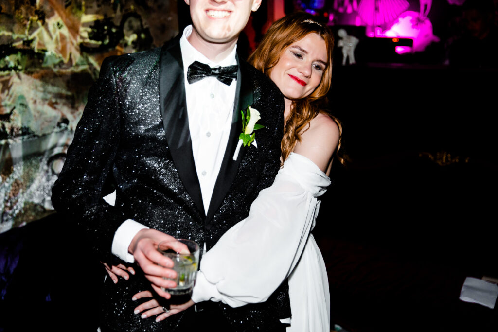 Bride and groom at Las Vegas wedding in glitter suit jacket