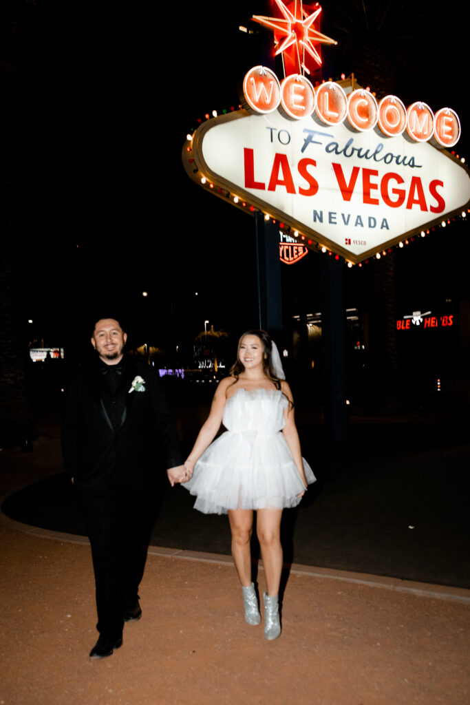 A couple eloping at the Welcome to Las Vegas Sign