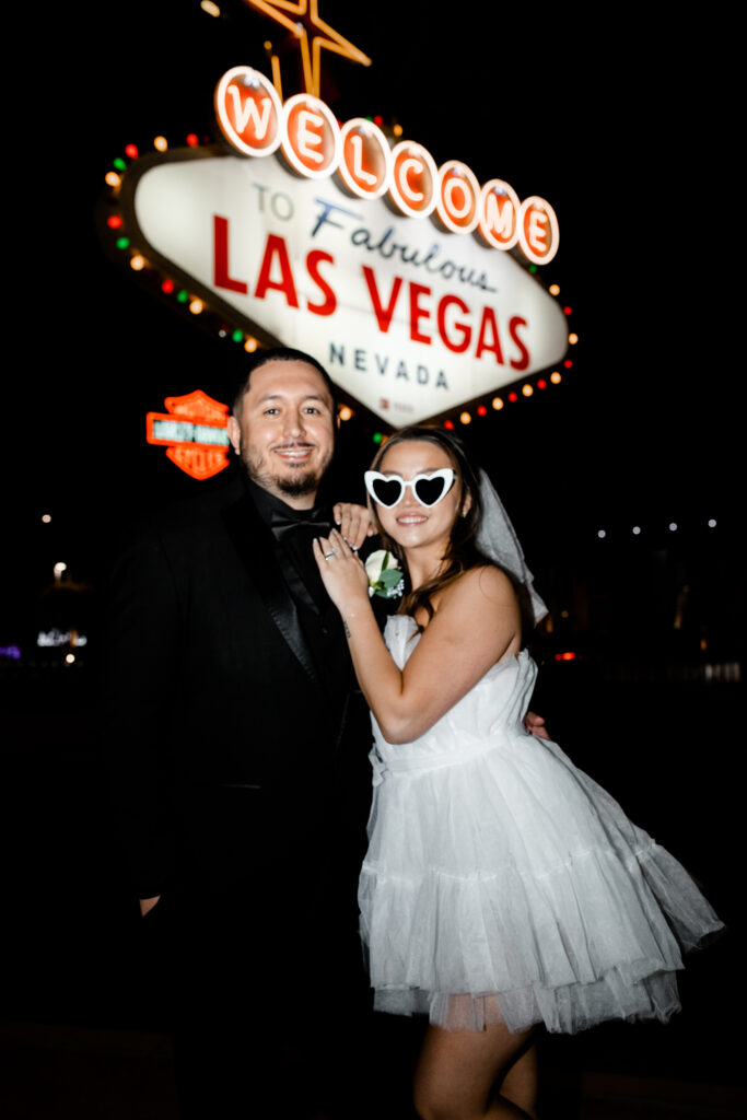 a bride and groom celebrating their Vegas elopement in style