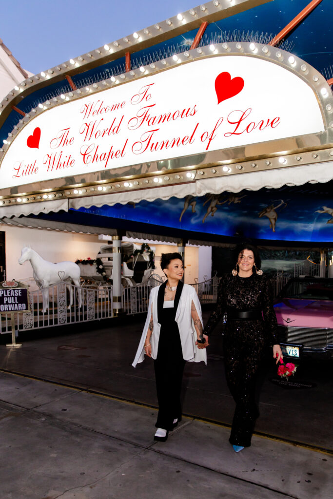 Newlywed couple driving away in convertible after ceremony at A Little White Chapel's drive-thru, Las Vegas