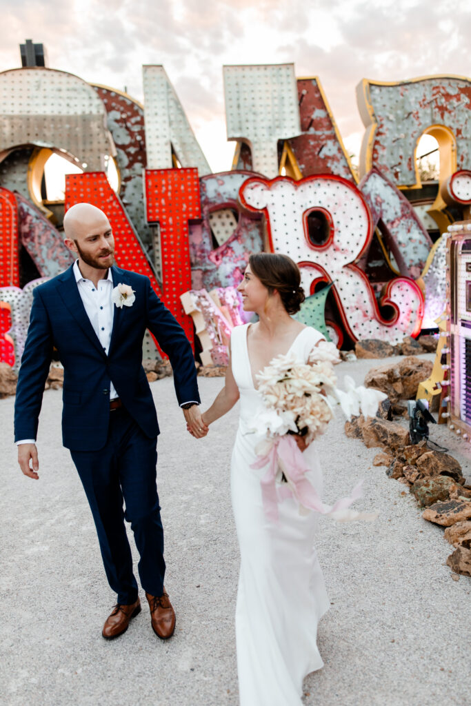 Las Vegas wedding photographer captures couple surrounded by neon signs