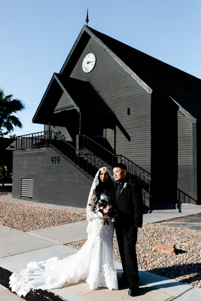 Las Vegas wedding photographer captures The bride and groom stand at the entrance of the Sonic Temple in Las Vegas, radiating excitement and love.