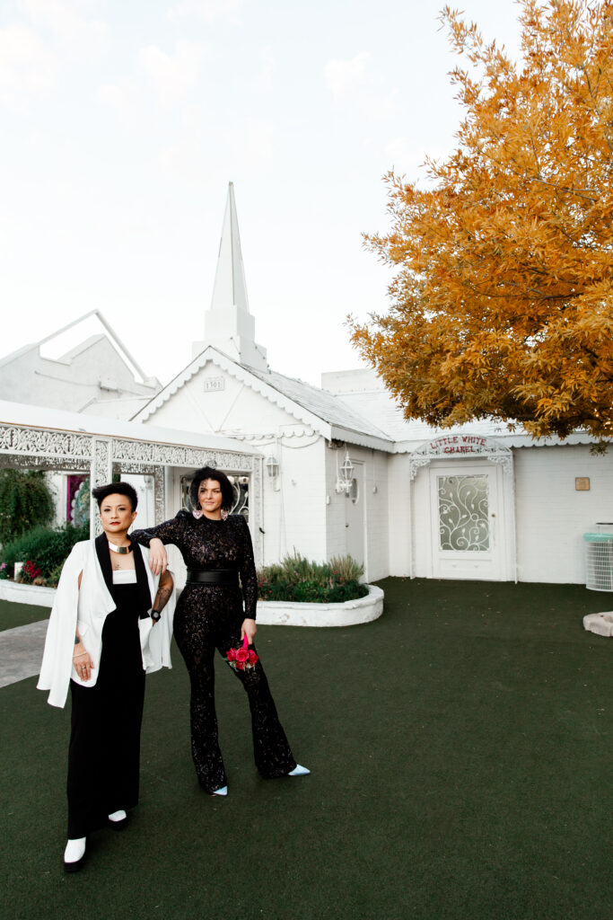 Las Vegas Photographer captures Newlywed couple posing for photos outside A Little White Chapel at dusk, Las Vegas