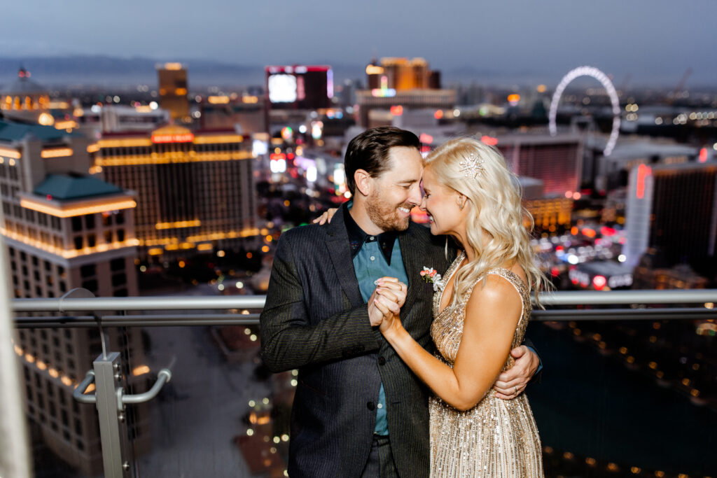 Las Vegas Photographer captures The newlyweds share their first dance on the balcony of their Cosmopolitan suite, illuminated by the city lights.