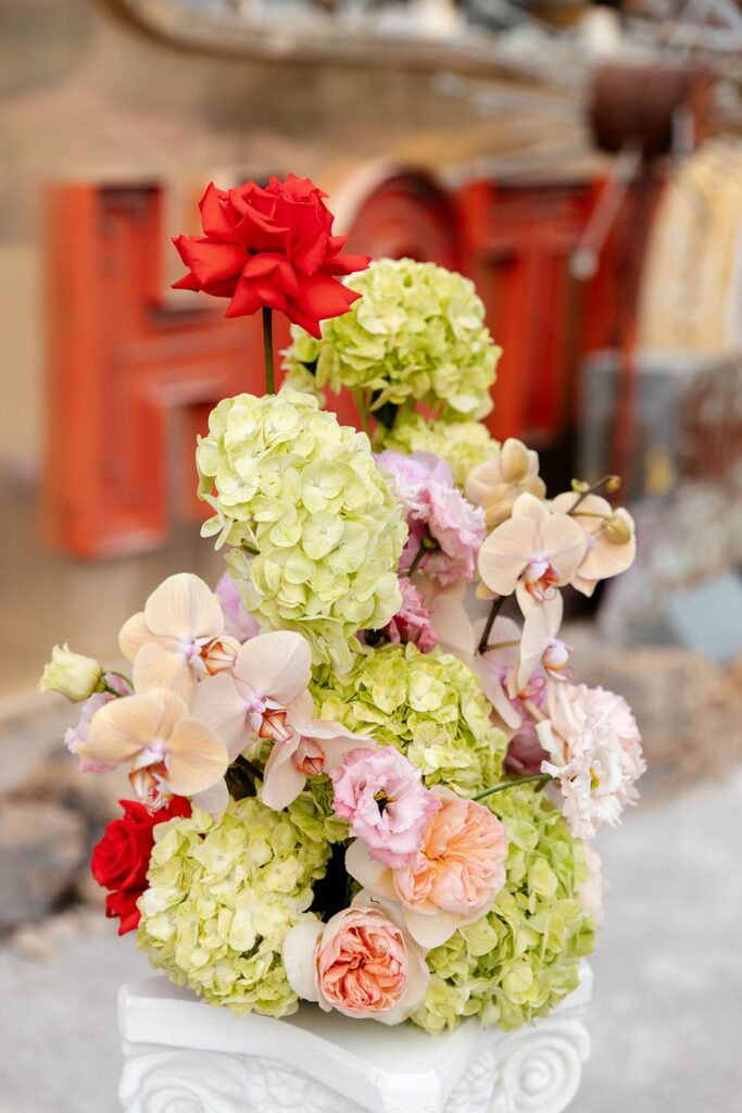 Colorful Neon Museum wedding ceremony décor with florals by Lucid Juliet