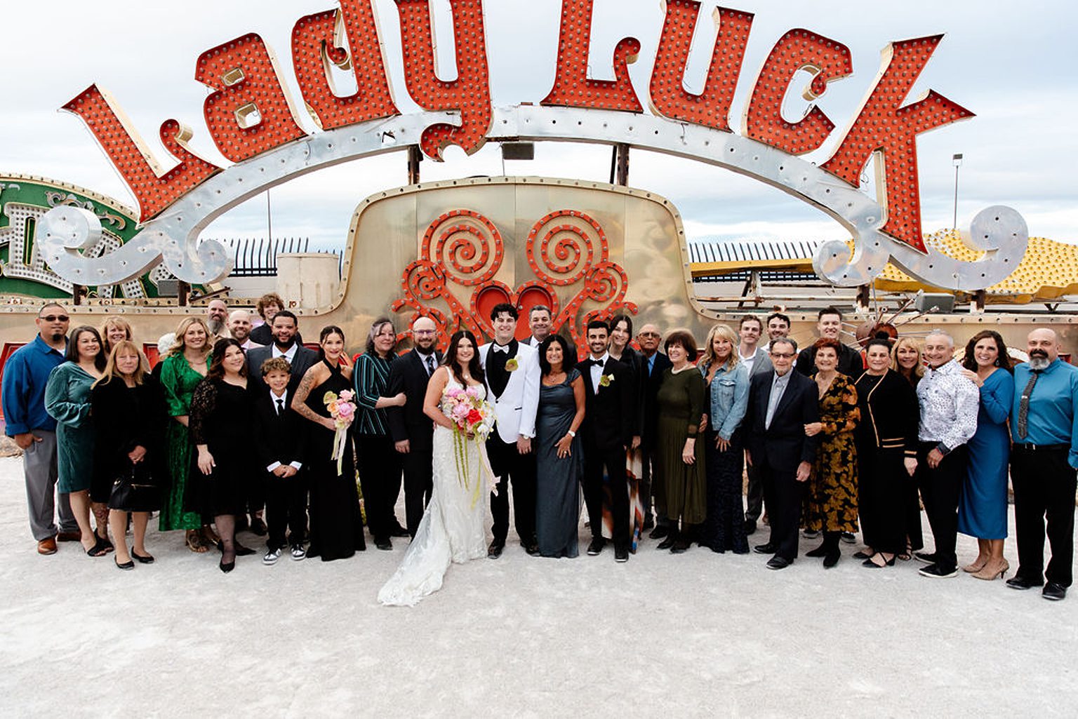 Bride and grooms group shot with their guests from their Neon Museum wedding in Las Vegas