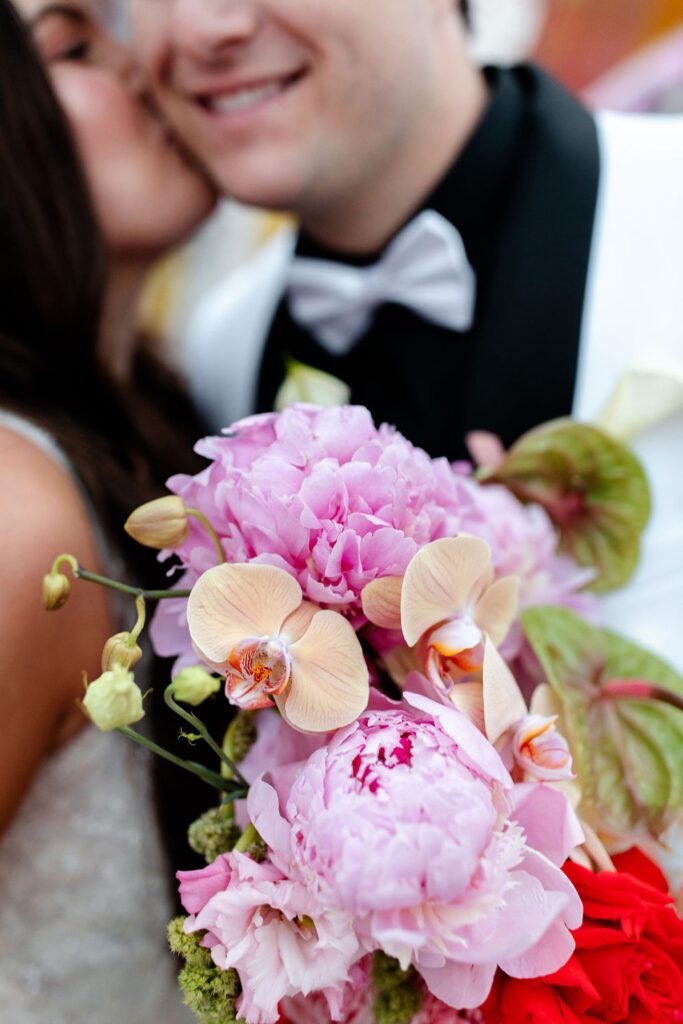 Bride and groom kissing during their Neon Museum wedding photos in Las Vegas