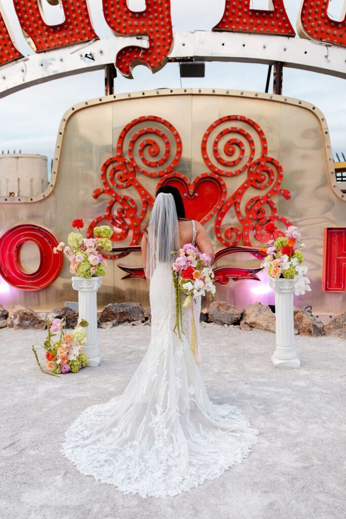 Bride posing for her Neon Museum wedding photos in Las Vegas