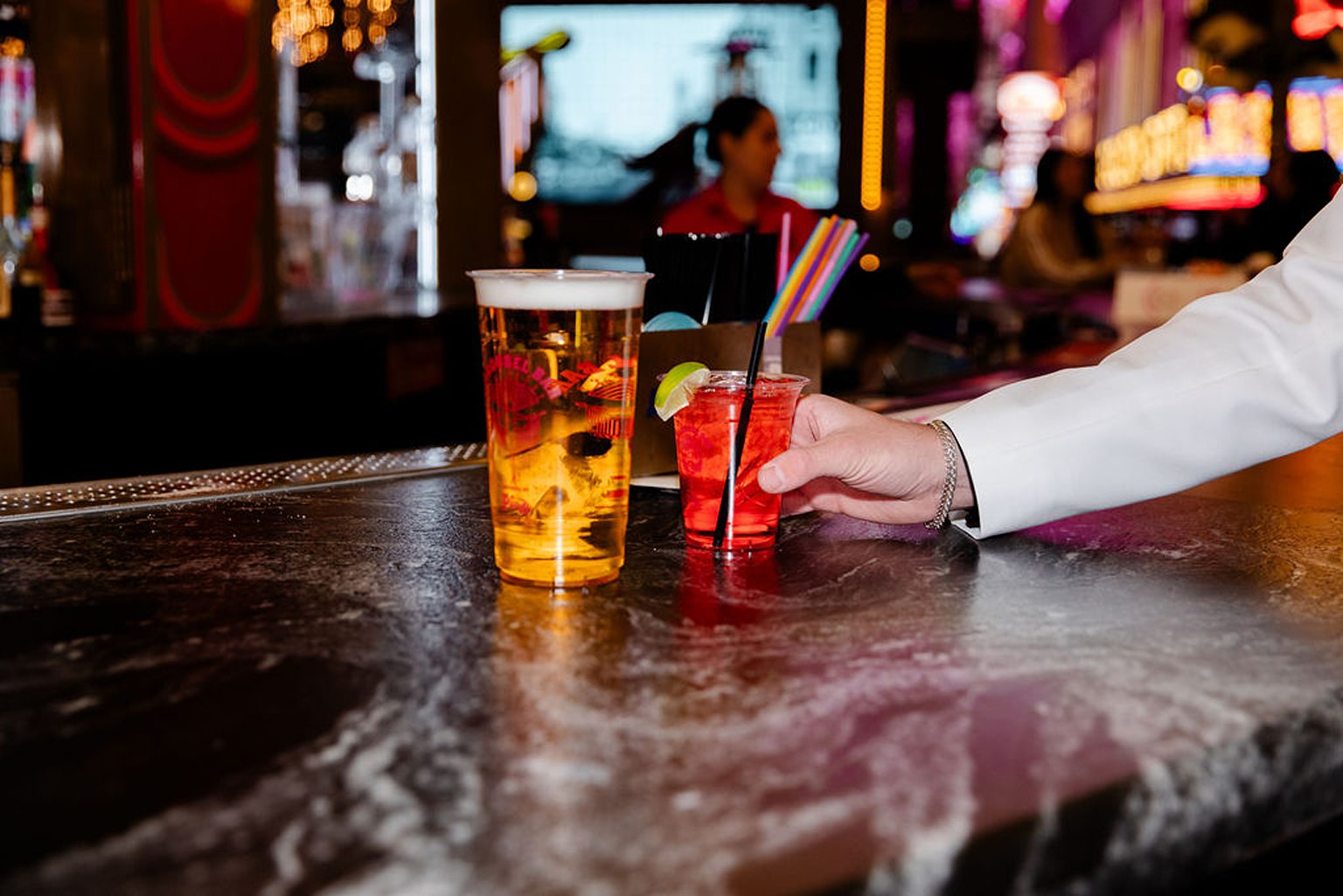 Bride and groom getting drinks at Carousel Bar on Fremont Street in Las Vegas