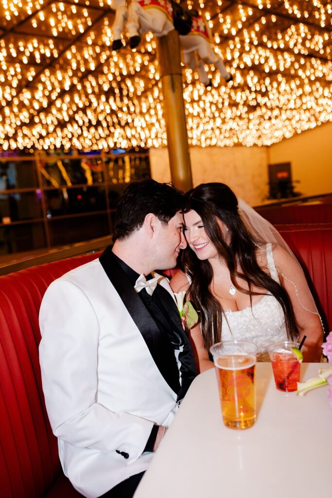 Bride and groom getting drinks at Carousel Bar on Fremont Street in Las Vegas