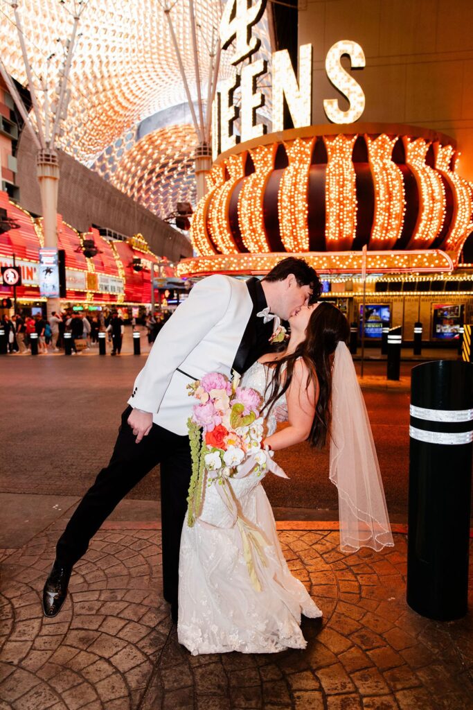 Bride and groom kissing in downtown Las Vegas