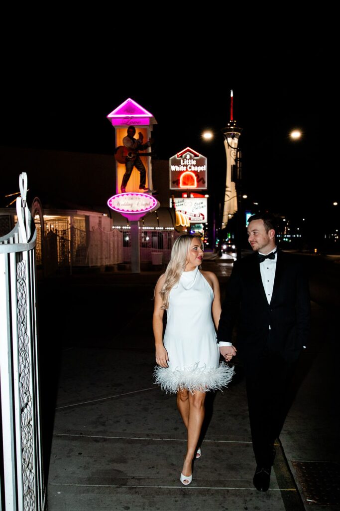 Couple posing in front of Little White Chapel