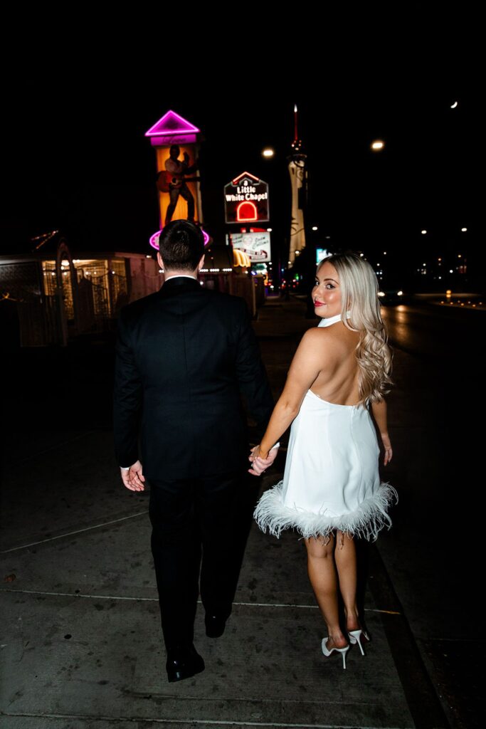 Couple posing in front of Little White Chapel