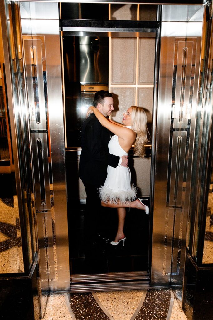 Couple posing in an elevator at The Cosmopolitan 