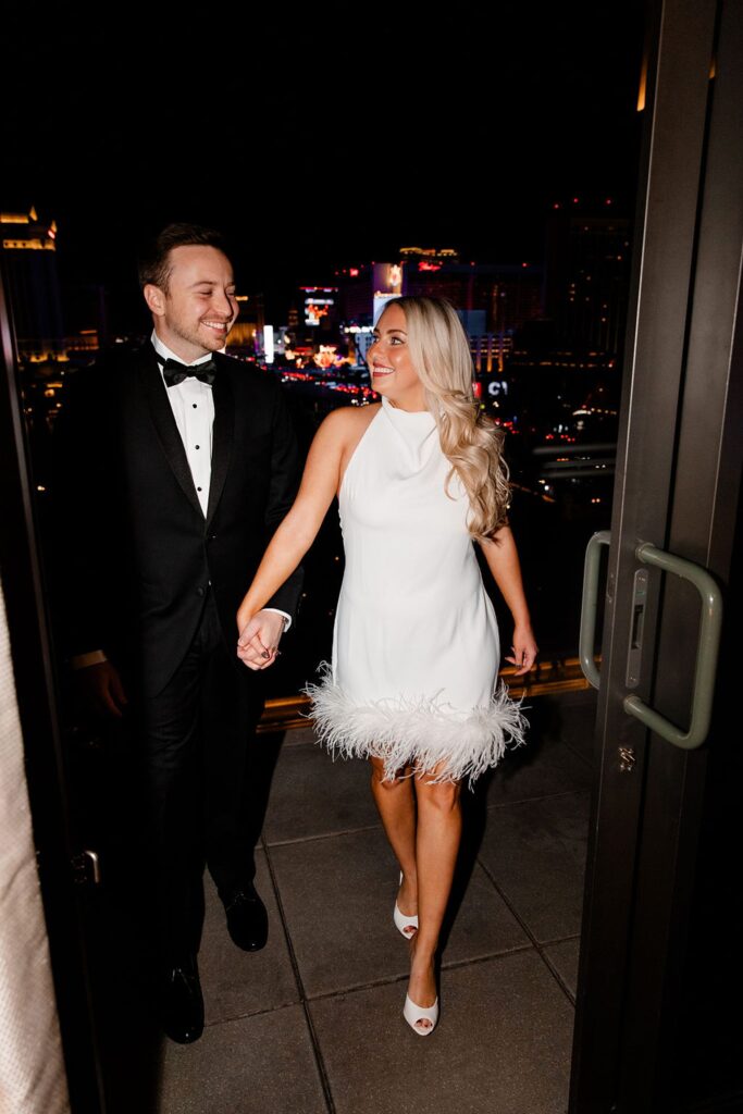 Couple posing on a hotel balcony in Las Vegas