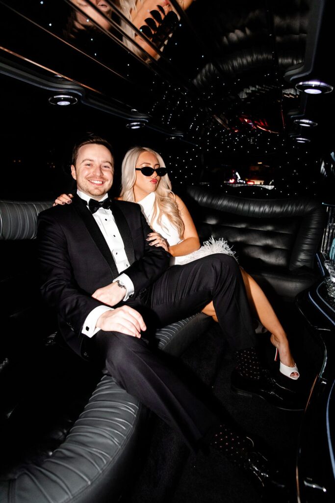 Couple posing in a limo for their timeless engagement photos in Las Vegas