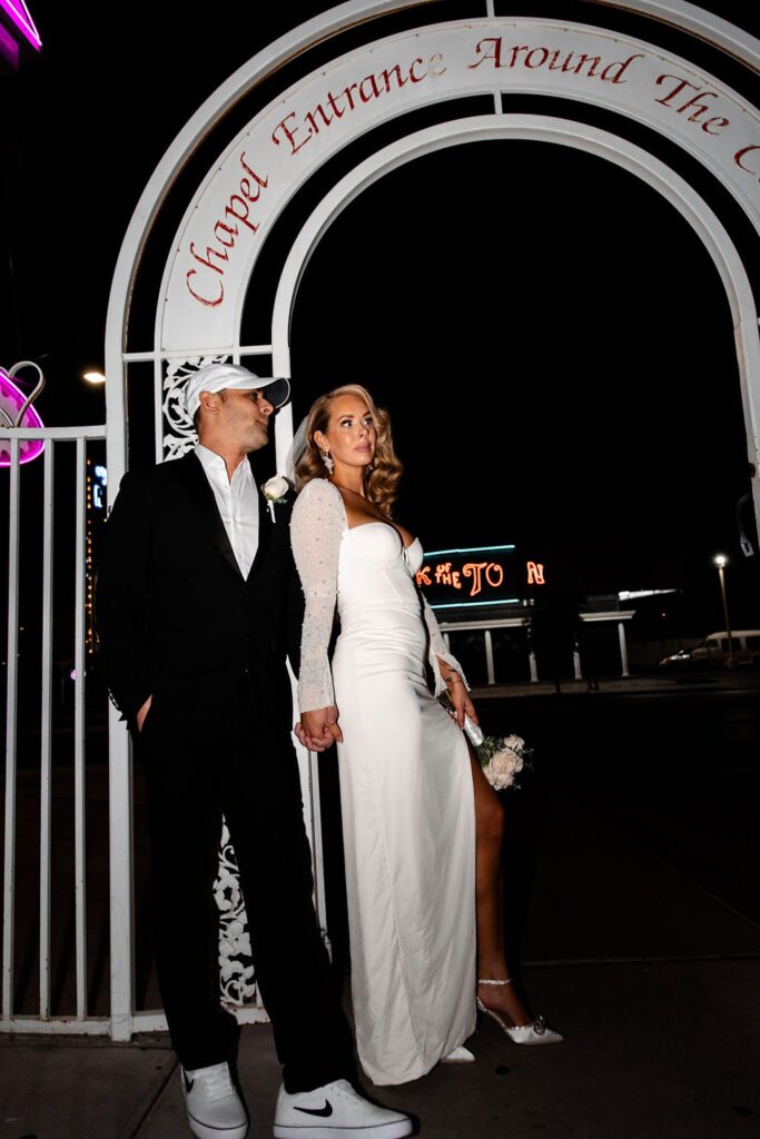 Editorial elopement photos of a bride and groom from their Vegas night elopement at Little White Wedding Chapel