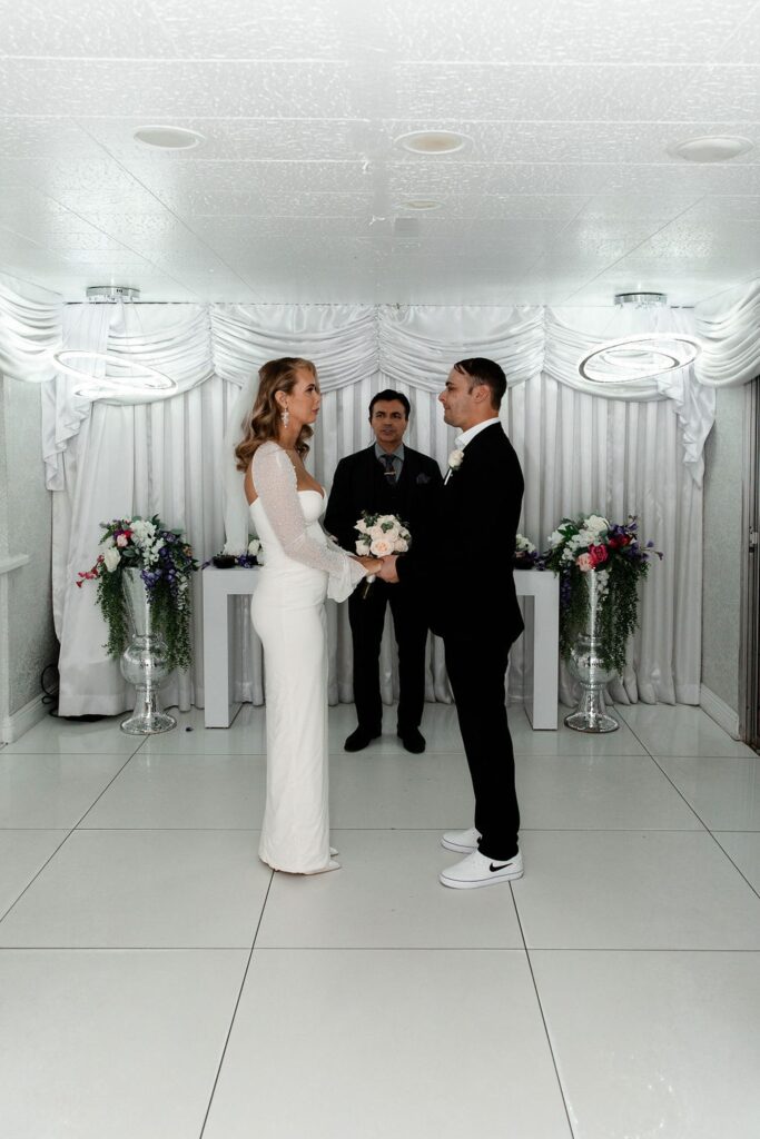 Couple holding hands during their Little White Wedding Chapel elopement in Las Vegas