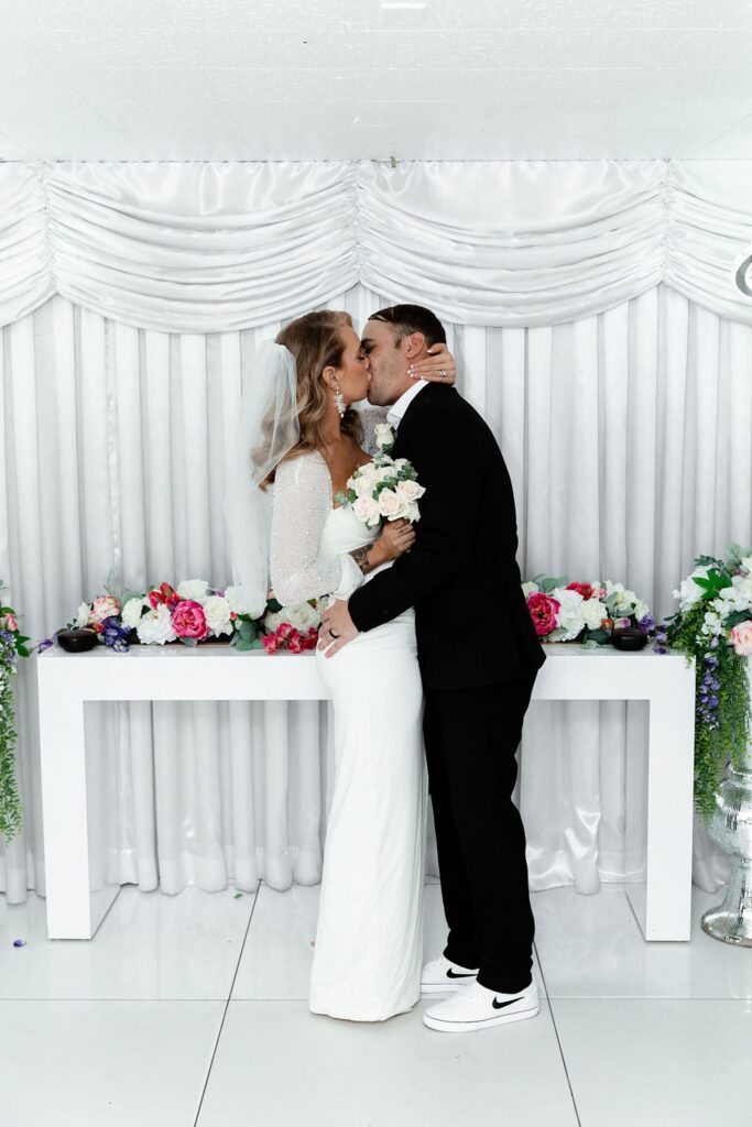 Bride and groom kissing during their Little White Wedding Chapel elopement ceremony