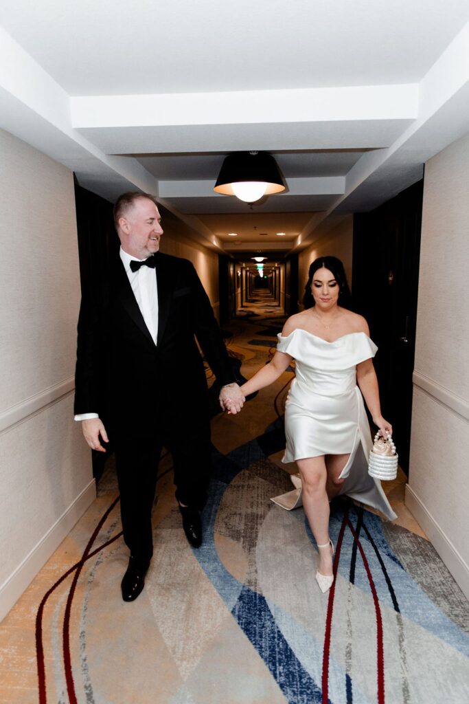 Bride and groom walking down the hallway at Paris Hotel in Las Vegas