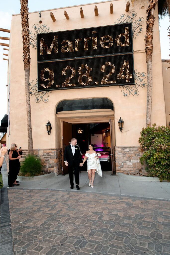 Bride and grooms Viva Las Vegas wedding exit