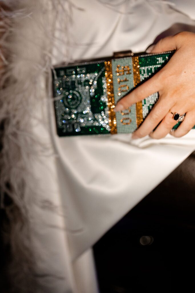 Las Vegas bridal style with a bedazzled money clutch