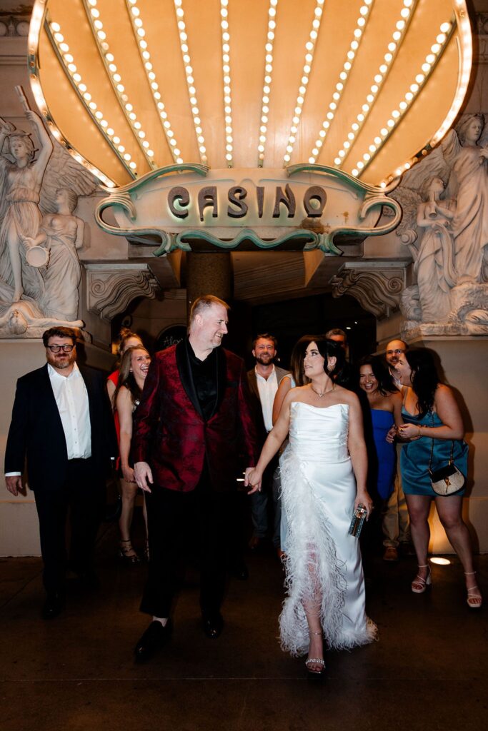 Bride, groom and their wedding party posing for portraits