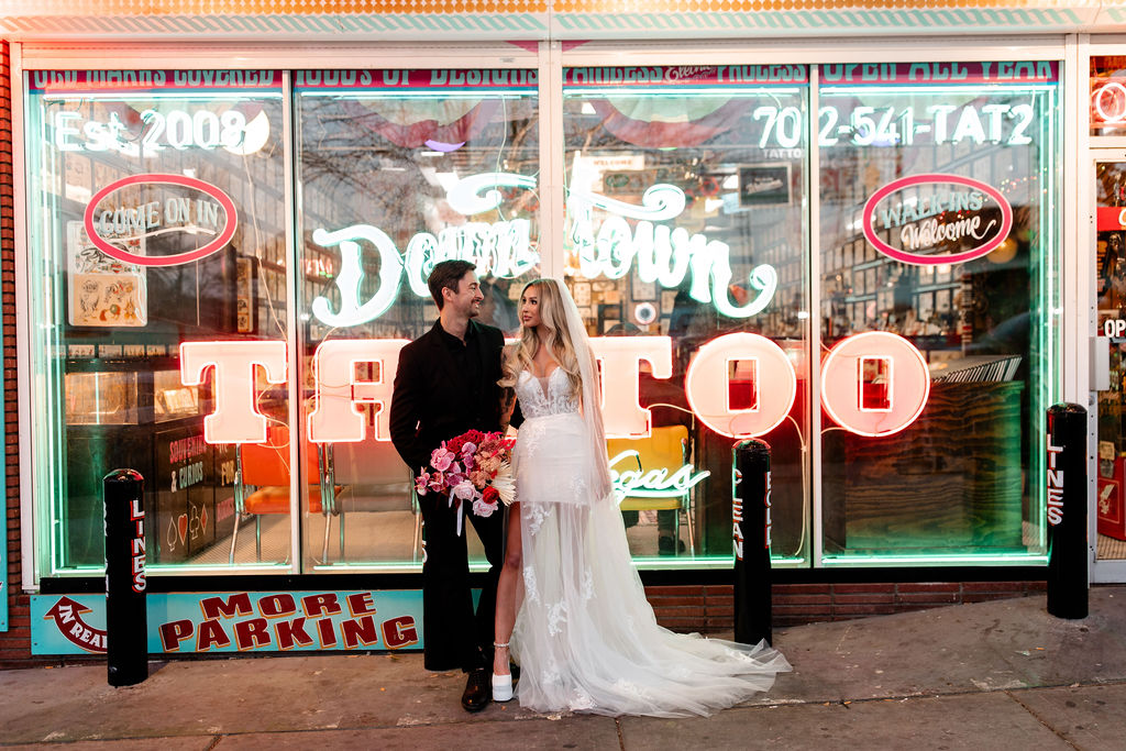 Couples editorial wedding photos in front of Downtown Tattoo on Fremont Street