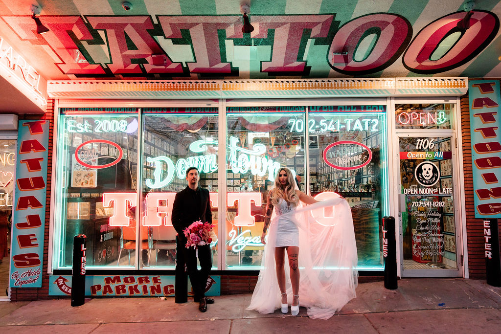 Couples editorial wedding photos in front of Downtown Tattoo on Fremont Street