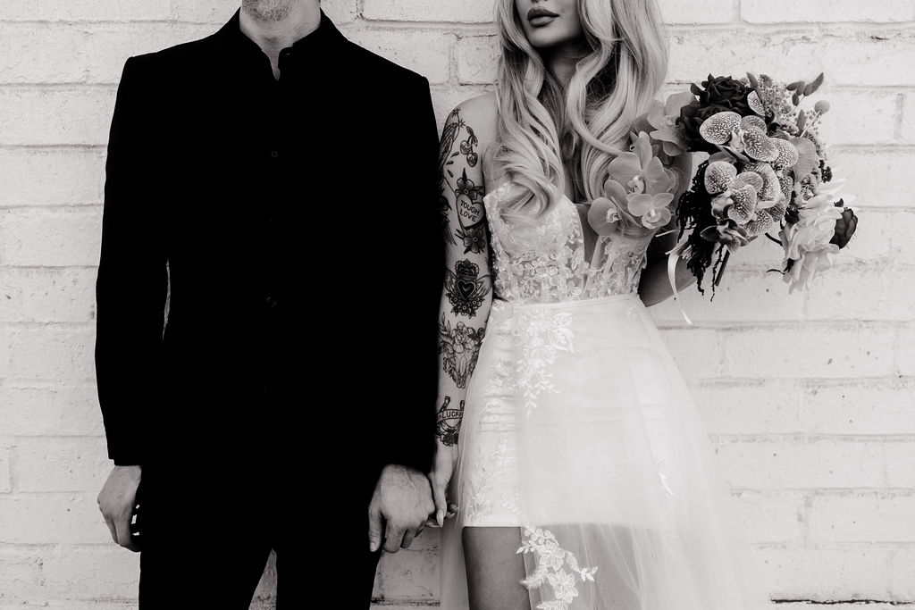 Black and white photo of a couple posing for their bridals