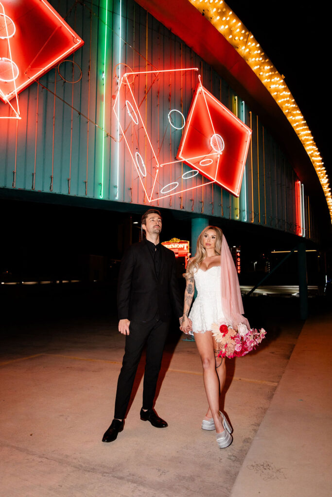 Couple posing for their vintage Las Vegas wedding photos on Binion's Rooftop