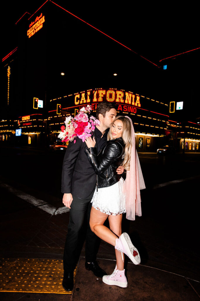 Couples vintage Las Vegas wedding photos in front of California Resort and Casino