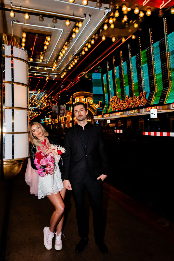 Couples flash Las Vegas wedding portraits in front of Binion's