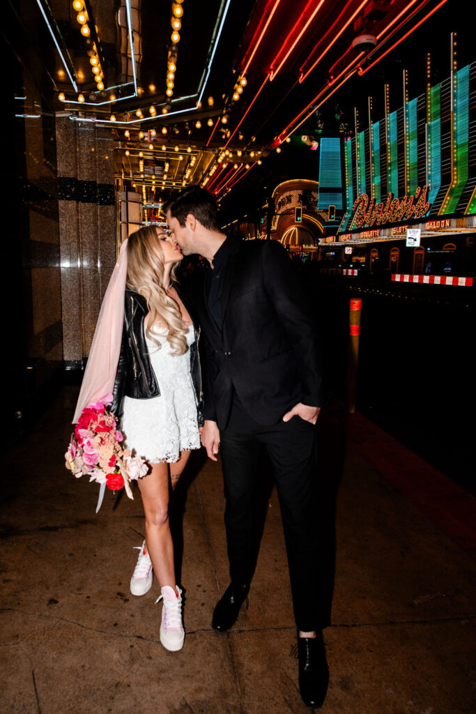 Couples flash Las Vegas wedding portraits in front of Binion's