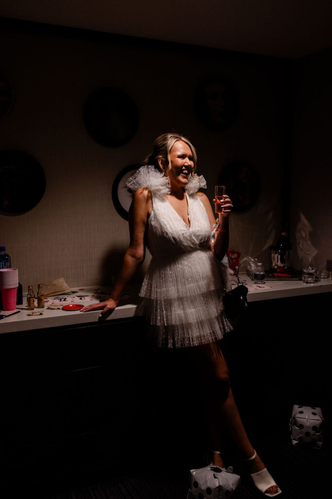 Bride posing for her Las Vegas bachelorette party photos in her suite at The Cosmopolitan 