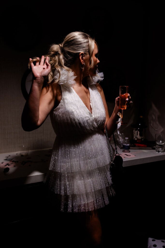 Bride posing for her Las Vegas bachelorette party photos in her suite at The Cosmopolitan 