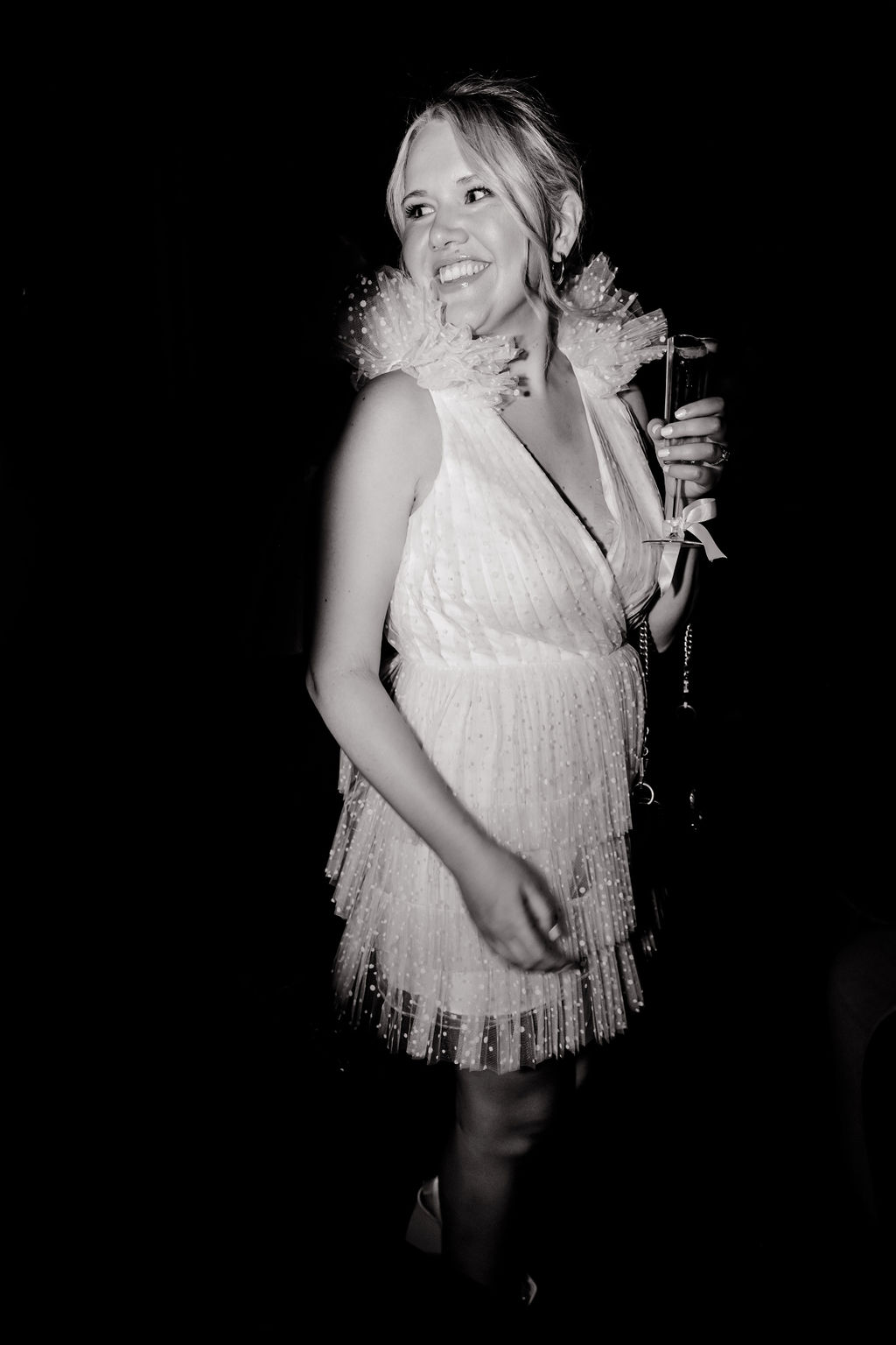 Black and white flash photo of a bride during her Las Vegas bachelorette party 