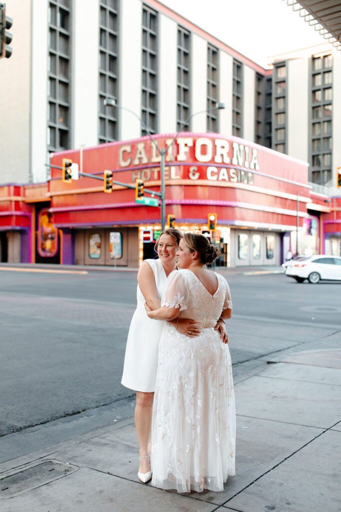 LGBTQ+ Vegas wedding photo in front of California Hotel and Casino