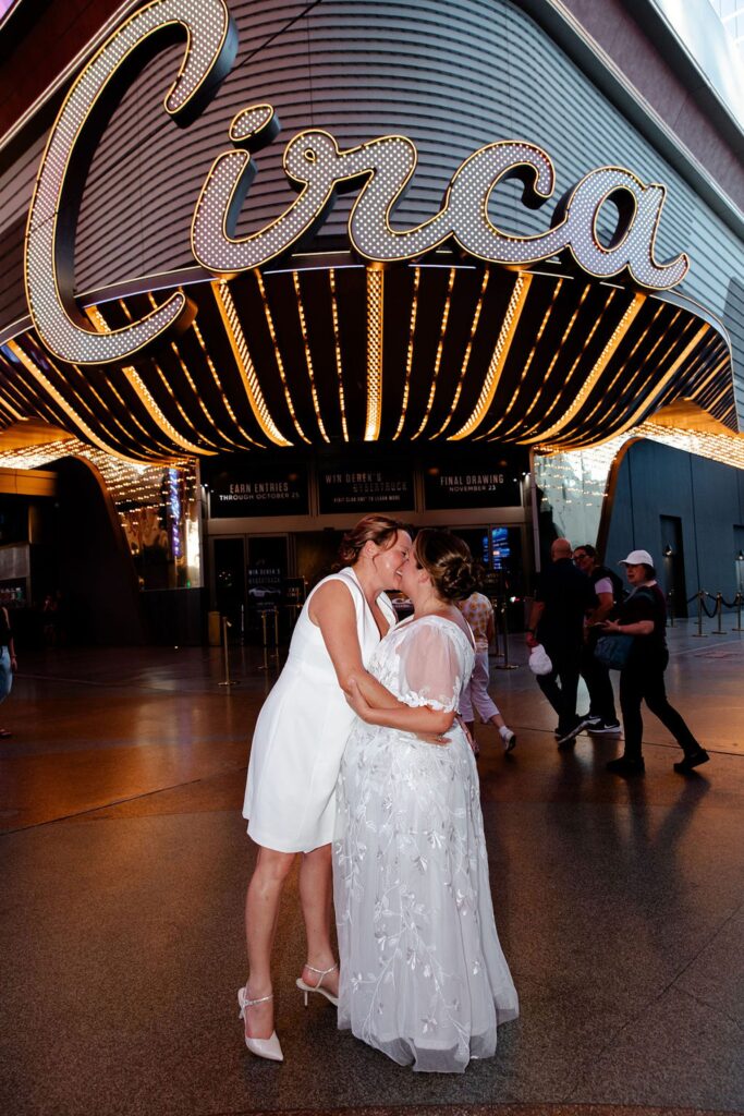 Couples kissing in front of Circa in Vegas