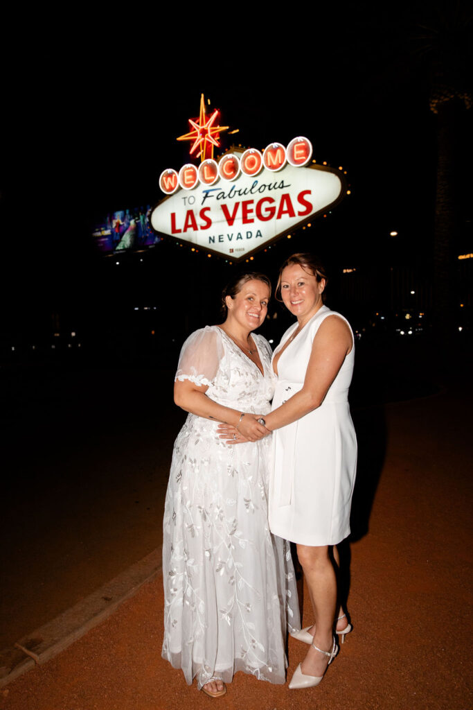 LGBTQ+ downtown Las Vegas wedding photos at the Welcome to Fabulous Las Vegas sign
