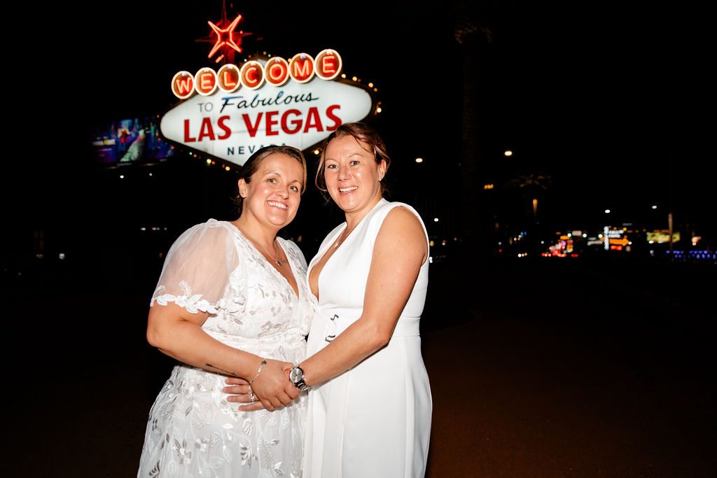 LGBTQ+ downtown Las Vegas wedding photos at the Welcome to Fabulous Las Vegas sign