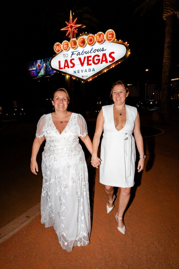 Couples downtown Las Vegas wedding photos in front of the Welcome to Fabulous Las Vegas sign