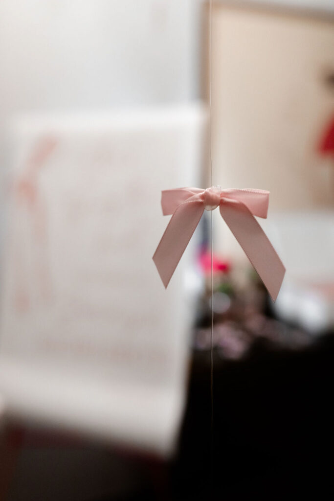 Close-up of pink bow hanging as party decor for a stylish Las Vegas bachelorette celebration