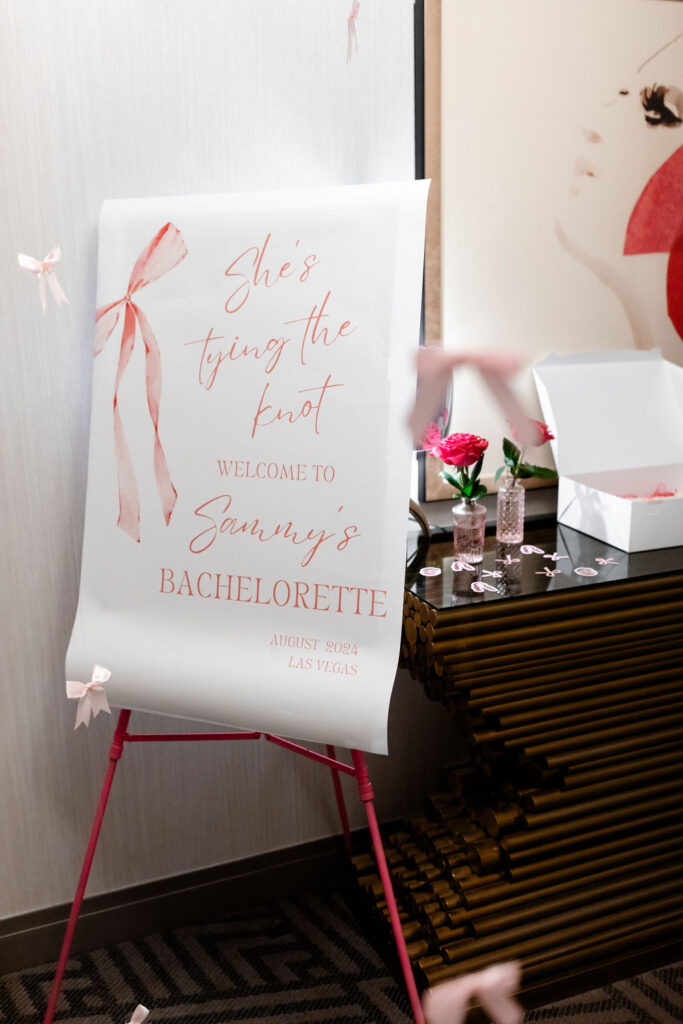 Personalized welcome sign for Las Vegas bachelorette party with pink ribbon detail
