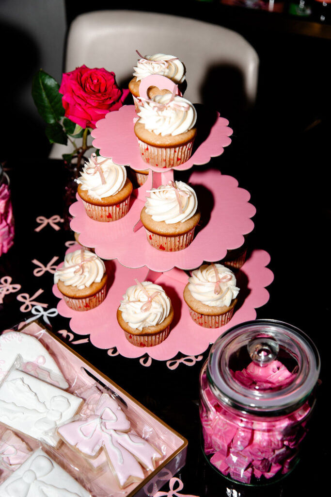 Bow-topped cupcakes and rose decor at a Las Vegas bachelorette party